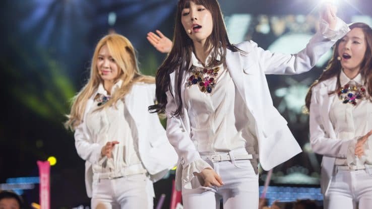 K-pop girl group performing on stage