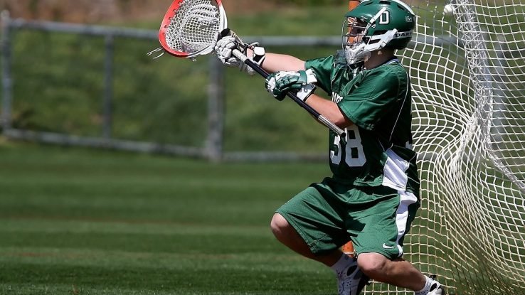 Green lacrosse team goalie