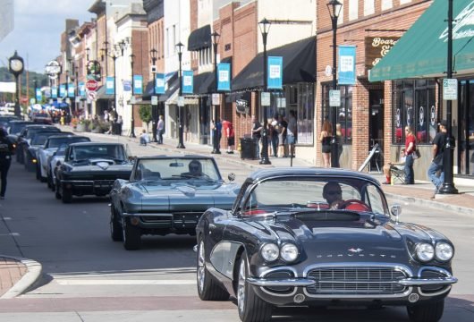 Car club driving through a city