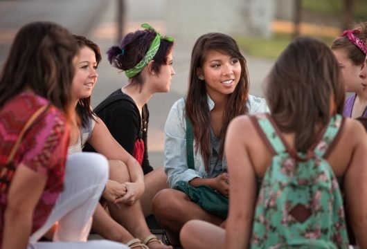 Youth group having a discussion outdoors