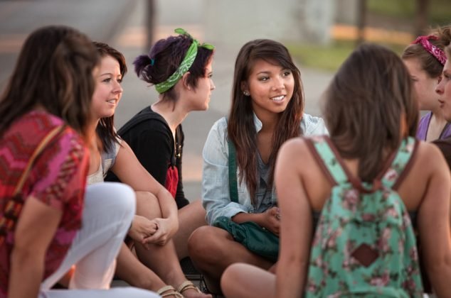 Youth group having a discussion outdoors